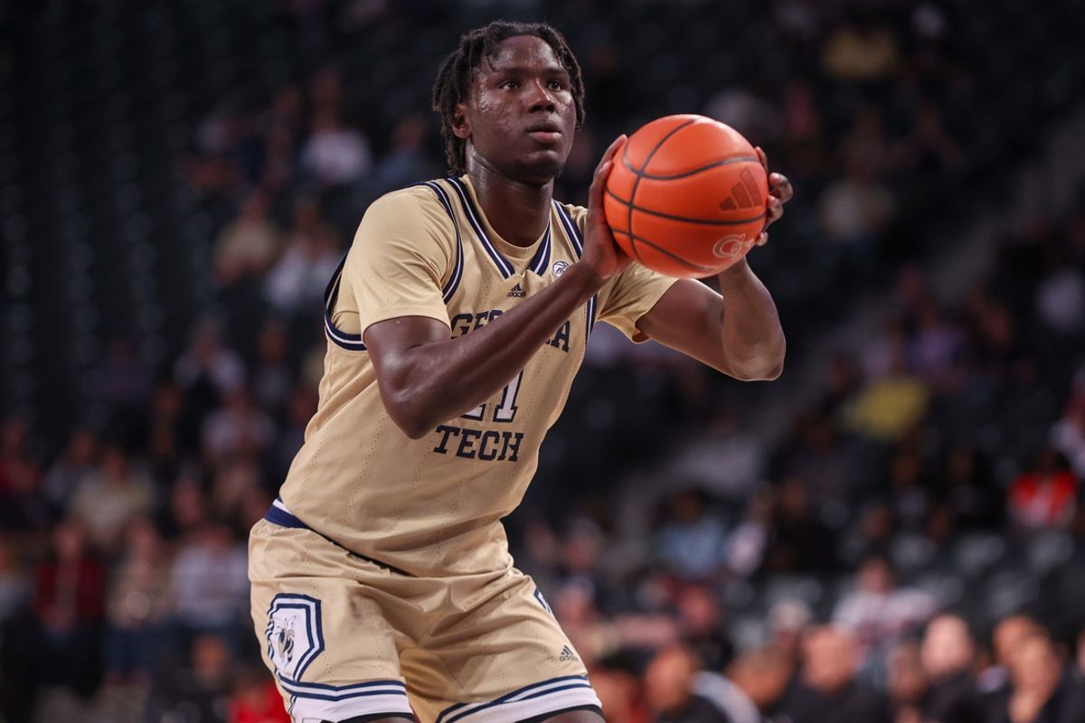Mar 1, 2025; Atlanta, Georgia, USA; Georgia Tech Yellow Jackets forward Baye Ndongo (11) shoots a free throw against the North Carolina State Wolfpack in the second half at McCamish Pavilion. Mandatory Credit: Brett Davis-Imagn Images