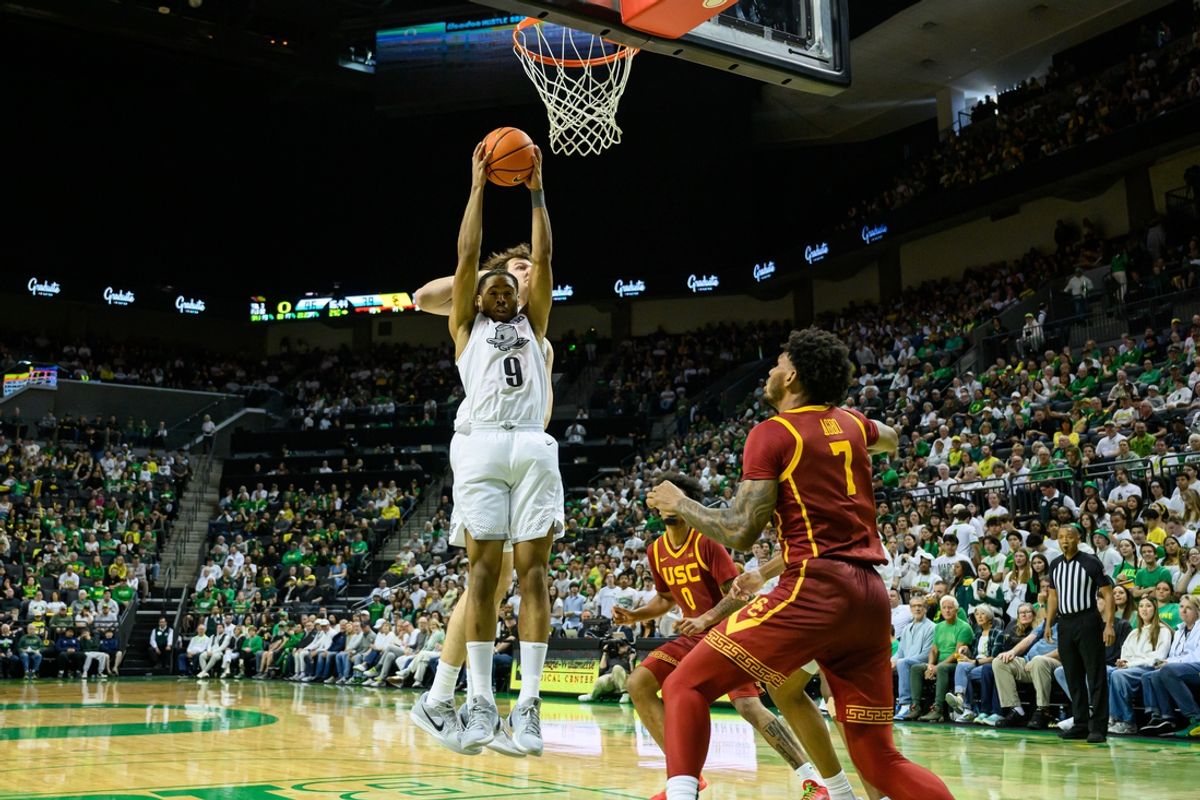 Mar 1, 2025; Eugene, Oregon, USA; Oregon Ducks guard Keeshawn Barthelemy (9) grabs a rebound against the USC Trojans during the second half at Matthew Knight Arena. Mandatory Credit: Craig Strobeck-Imagn Images