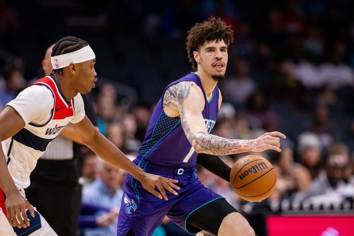 Mar 1, 2025; Charlotte, North Carolina, USA; Charlotte Hornets guard LaMelo Ball (1) brings the ball up court against the Washington Wizards during the first quarter at Spectrum Center. Mandatory Credit: Scott Kinser-Imagn Images