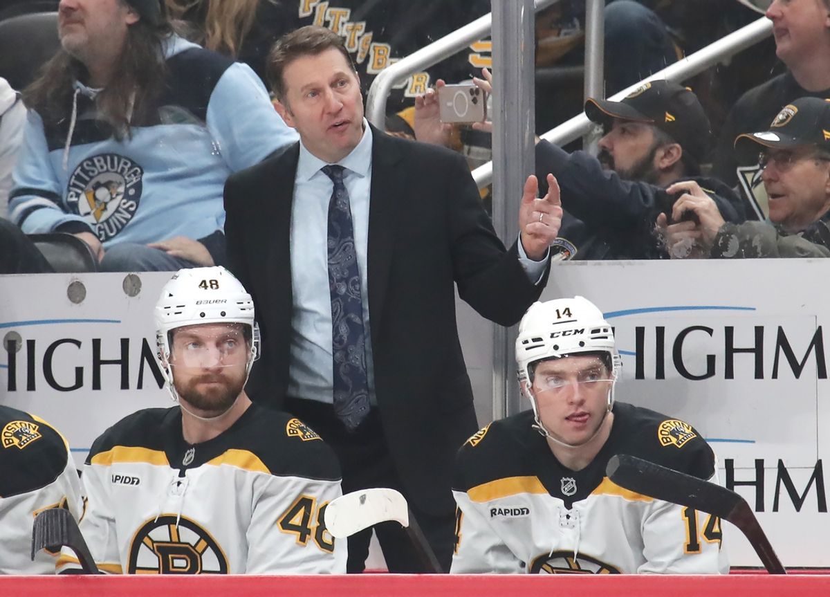 Mar 1, 2025; Pittsburgh, Pennsylvania, USA;  Boston Bruins interim head coach Joe Sacco (rear) reacts on the bench against the Pittsburgh Penguins during the third period at PPG Paints Arena. Mandatory Credit: Charles LeClaire-Imagn Images