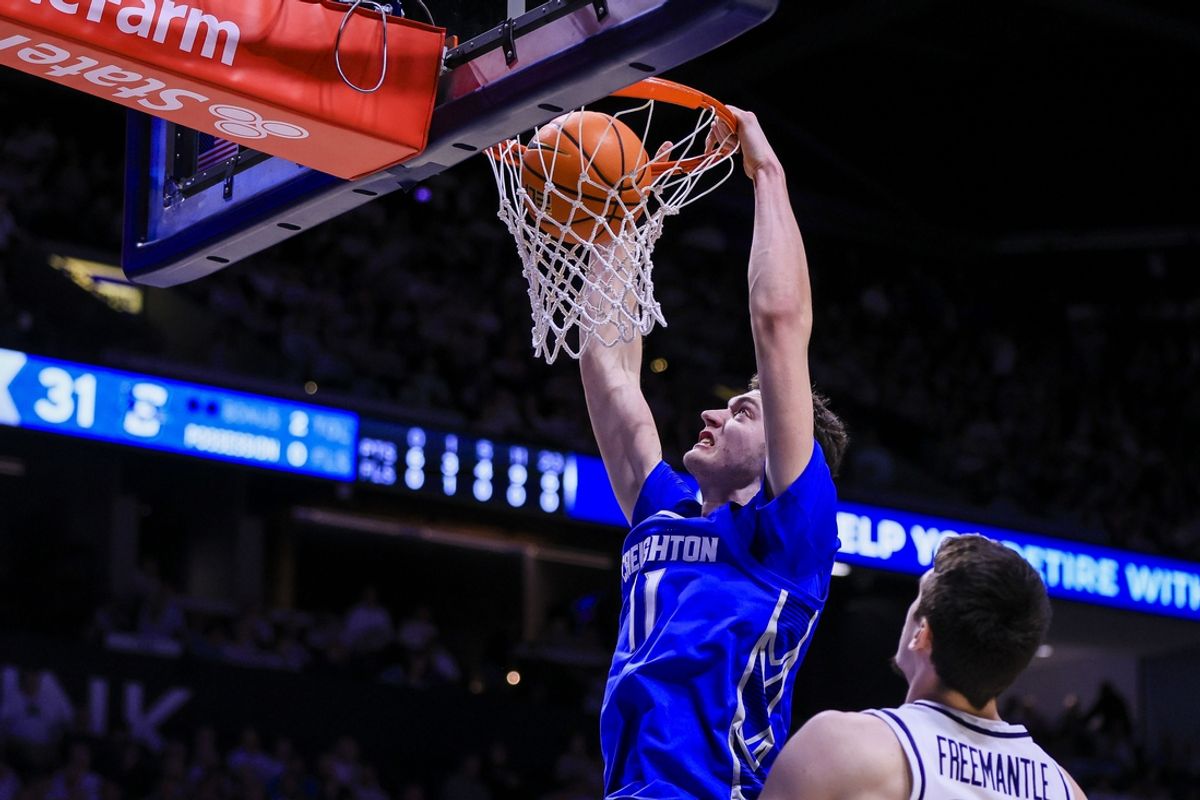 Mar 1, 2025; Cincinnati, Ohio, USA; Creighton Bluejays center Ryan Kalkbrenner (11) dunks on Xavier Musketeers forward Zach Freemantle (32) in the second half at Cintas Center. Mandatory Credit: Katie Stratman-Imagn Images
