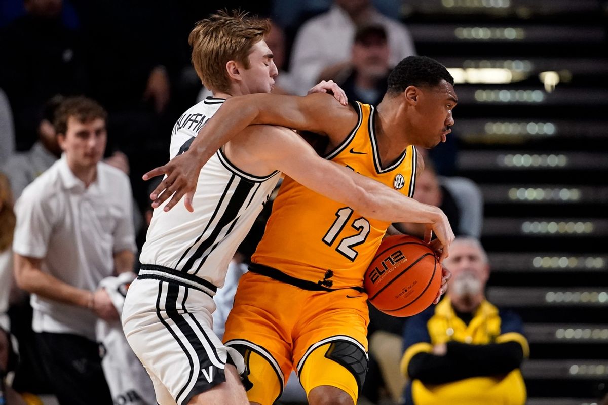 Vanderbilt guard Grant Huffman (4) fouls Missouri guard Tony Perkins (12) during the first half at Memorial Gym in Nashville, Tenn., Saturday, March 1, 2025.