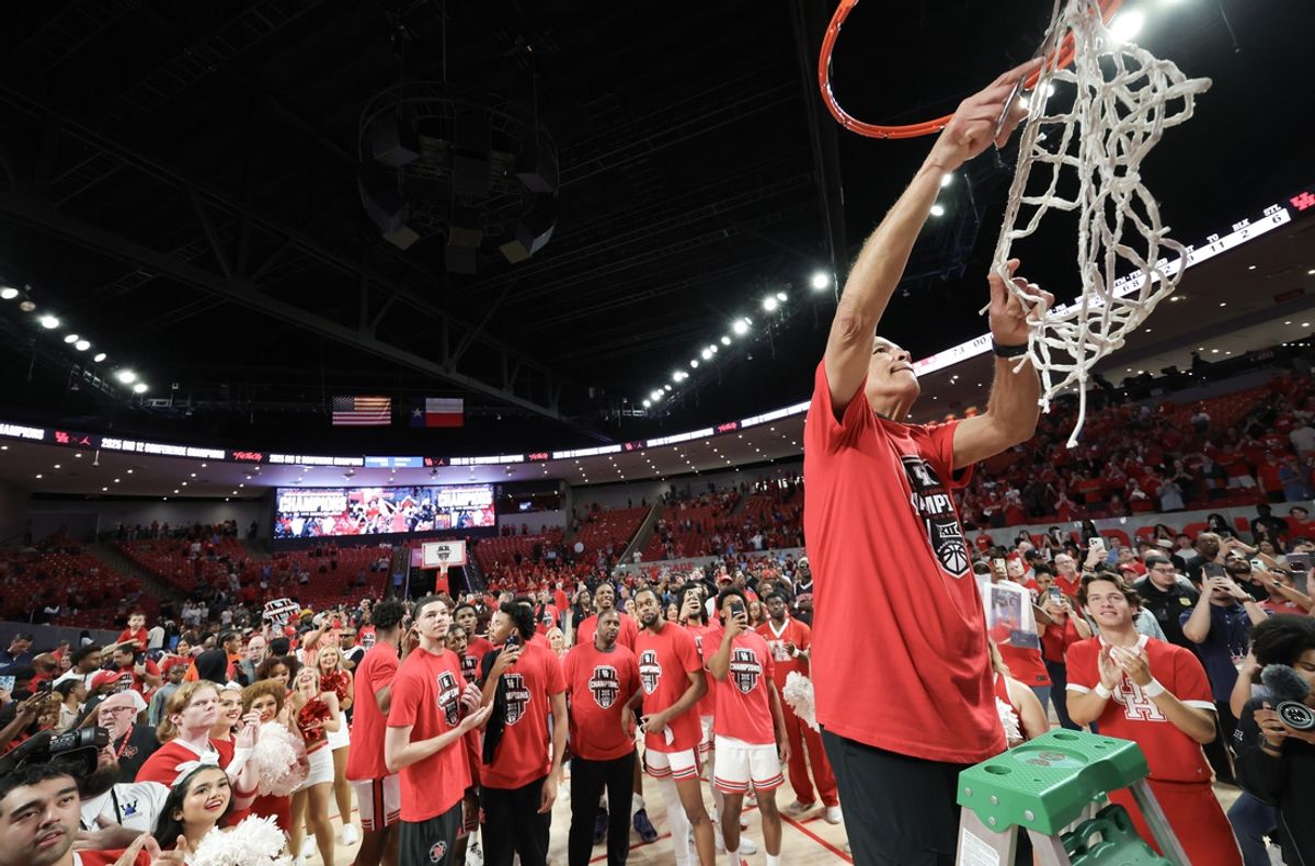 Mar 1, 2025; Houston, Texas, USA;  Houston Cougars head coach Kelvin Sampson cuts down the net and celebrates after winning the Big 12 Conference after defeating the Cincinnati Bearcats at Fertitta Center. Mandatory Credit: Thomas Shea-Imagn Images
