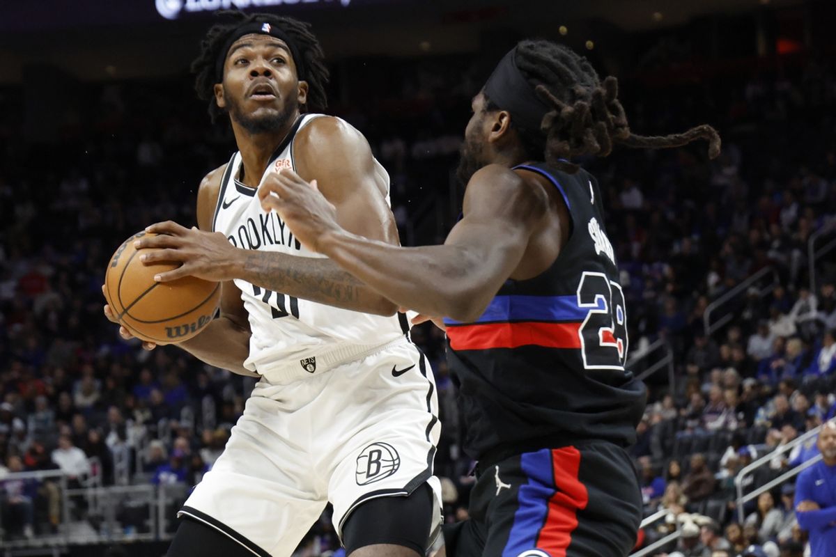 Mar 1, 2025; Detroit, Michigan, USA;  Brooklyn Nets center Day'Ron Sharpe (20) is defended by Detroit Pistons center Isaiah Stewart (28) in the first half at Little Caesars Arena. Mandatory Credit: Rick Osentoski-Imagn Images