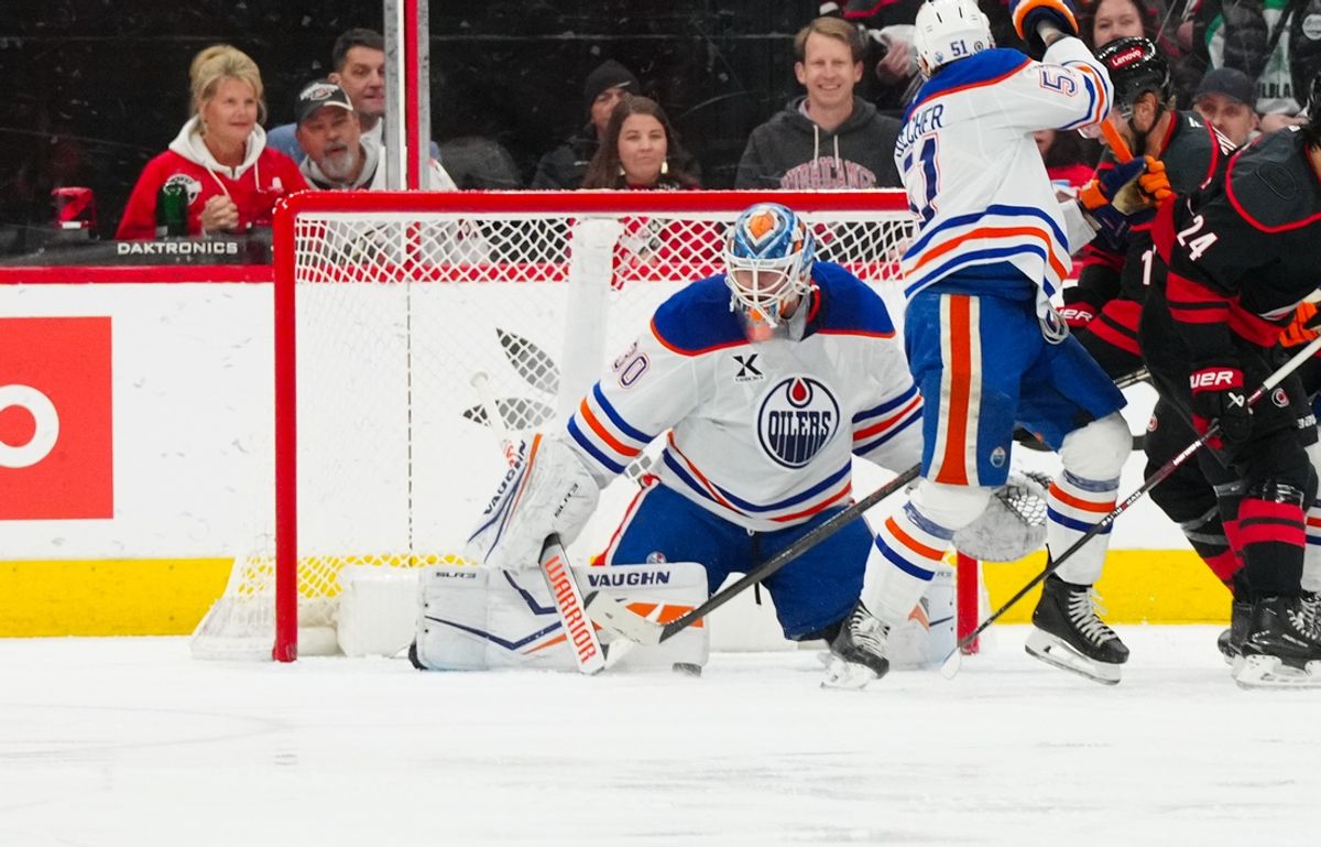Mar 1, 2025; Raleigh, North Carolina, USA;  Edmonton Oilers goaltender Calvin Pickard (30) makes a save against the Carolina Hurricanes during the second period at Lenovo Center. Mandatory Credit: James Guillory-Imagn Images