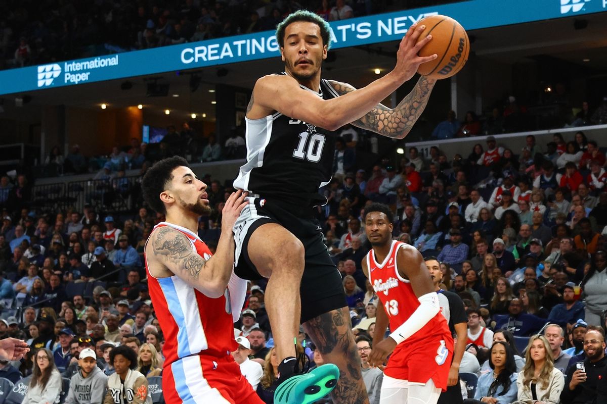 Mar 1, 2025; Memphis, Tennessee, USA; San Antonio Spurs forward Jeremy Sochan (10) collects a rebound over Memphis Grizzlies guard Scotty Pippen Jr. (1) during the second quarter at FedExForum. Mandatory Credit: Petre Thomas-Imagn Images