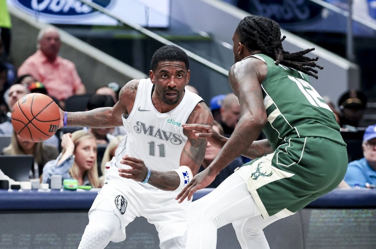 Mar 1, 2025; Dallas, Texas, USA;  Dallas Mavericks guard Kyrie Irving (11) drives to the basket as Milwaukee Bucks forward Taurean Prince (12) defends during the first half at American Airlines Center. Mandatory Credit: Kevin Jairaj-Imagn Images