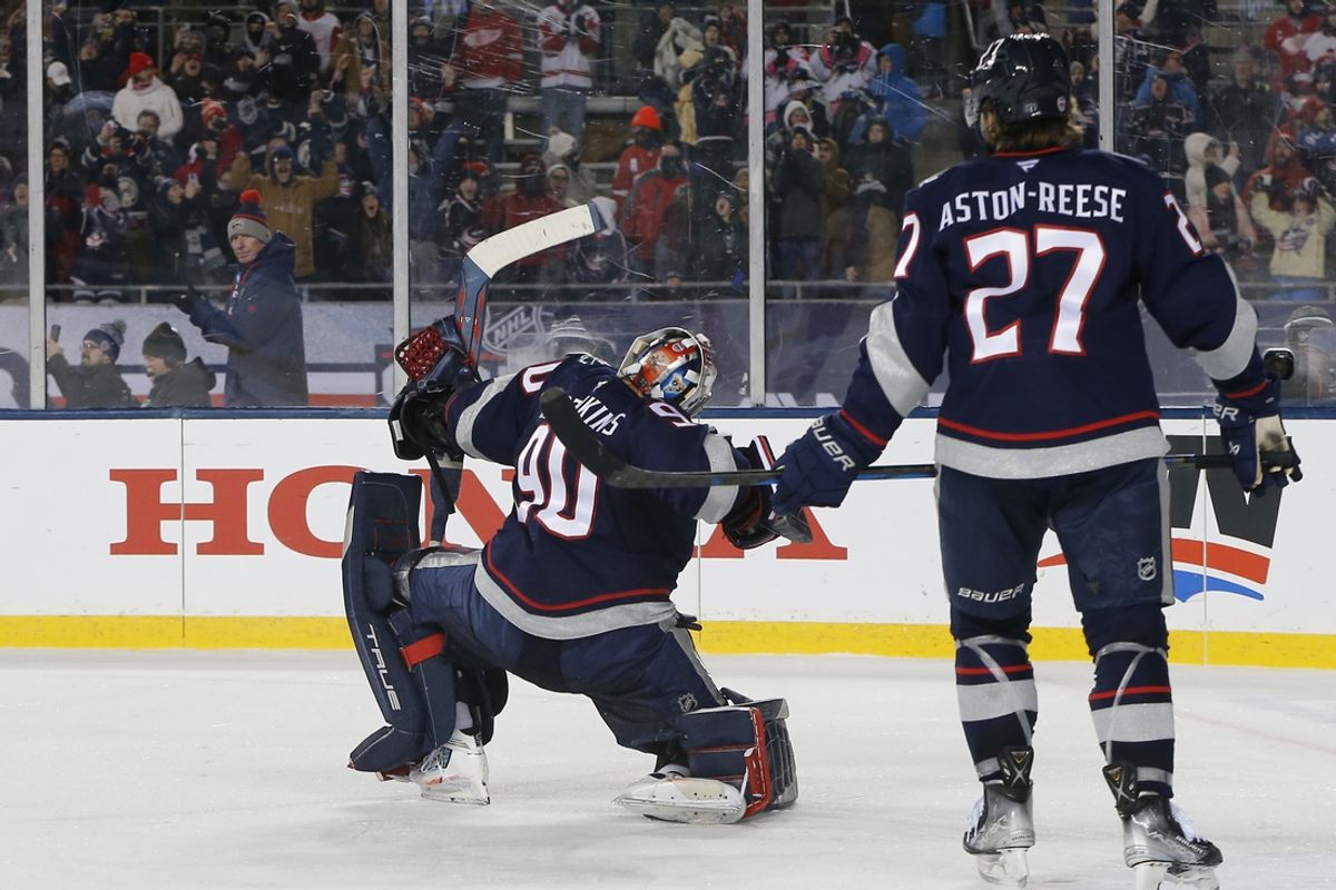 Mar 1, 2025; Columbus, Ohio, USA; Columbus Blue Jackets goalie Elvis Merzlikins (90) celebrates the win over Detroit Red Wings after the game at Ohio Stadium. Mandatory Credit: Russell LaBounty-Imagn Images