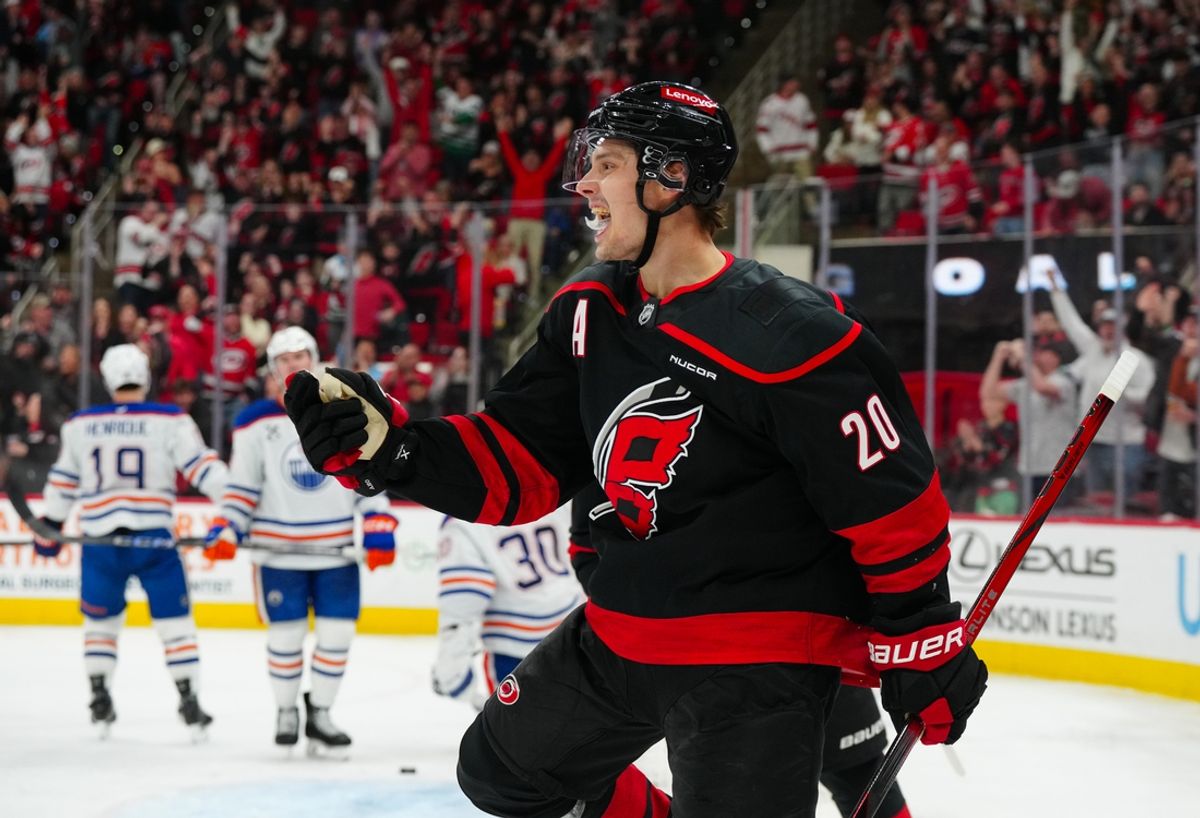 Mar 1, 2025; Raleigh, North Carolina, USA;  Carolina Hurricanes center Sebastian Aho (20) celebrates his goal against the Edmonton Oilers during the third period at Lenovo Center. Mandatory Credit: James Guillory-Imagn Images
