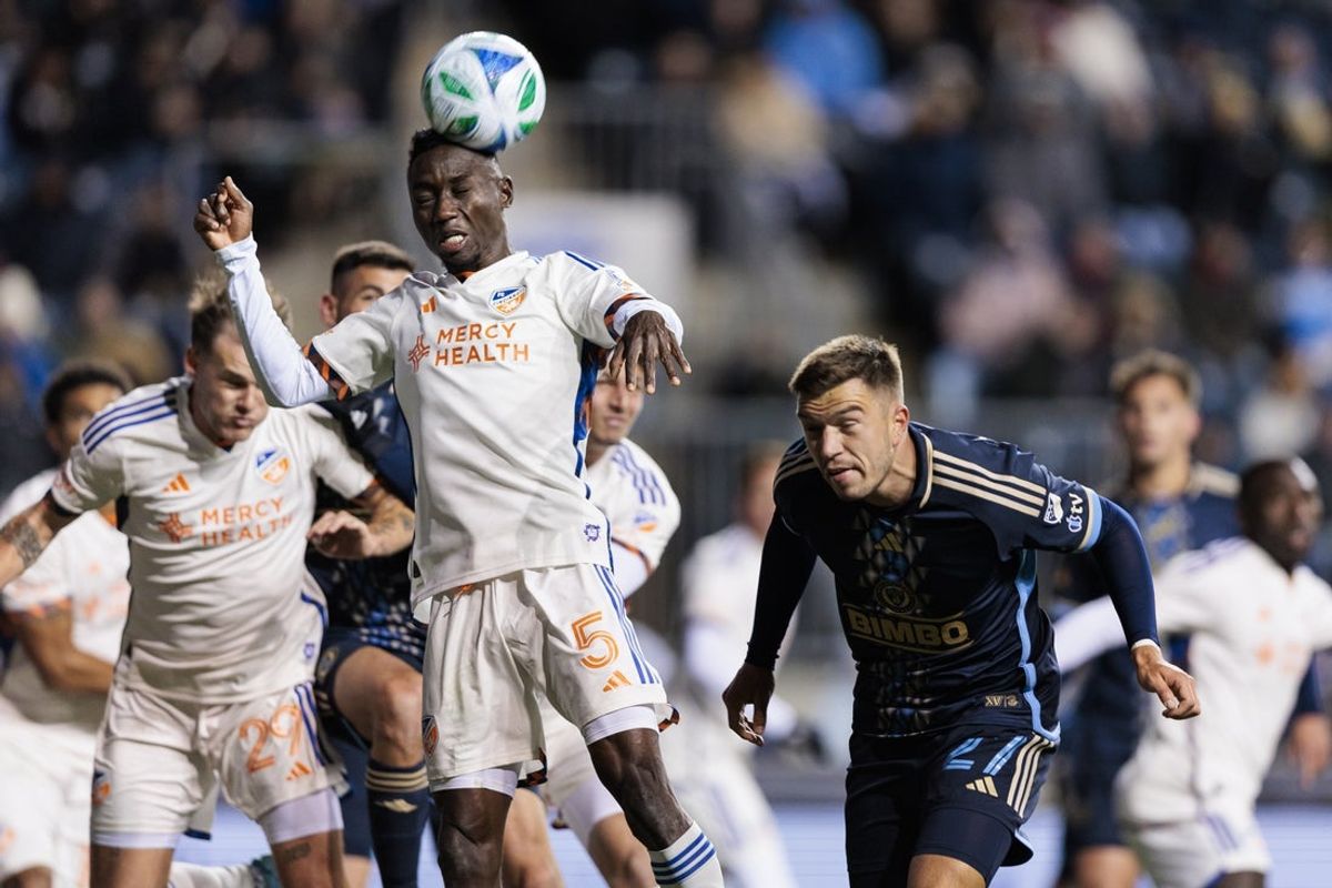 Mar 1, 2025; Chester, Pennsylvania, USA; FC Cincinnati midfielder Obinna Nwobodo (5) heads the ball from a corner kick during the second half against the Philadelphia Union at Subaru Park. Mandatory Credit: Caean Couto-Imagn Images