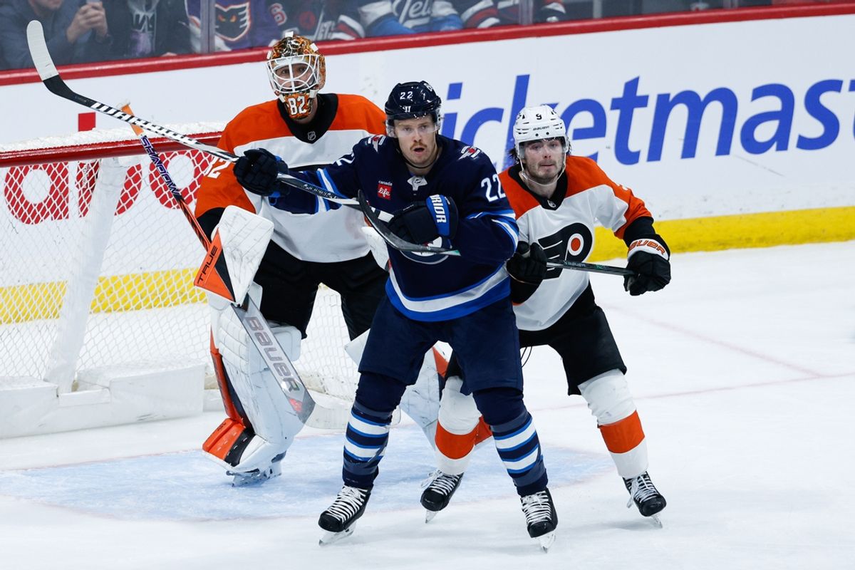 Mar 1, 2025; Winnipeg, Manitoba, CAN;  Winnipeg Jets forward Mason Appleton (22) jostles for position with Philadelphia Flyers defenseman Jamie Drysdale (9) in front of Philadelphia Flyers goalie Ivan Fedotov (82) during the third period at Canada Life Centre. Mandatory Credit: Terrence Lee-Imagn Images