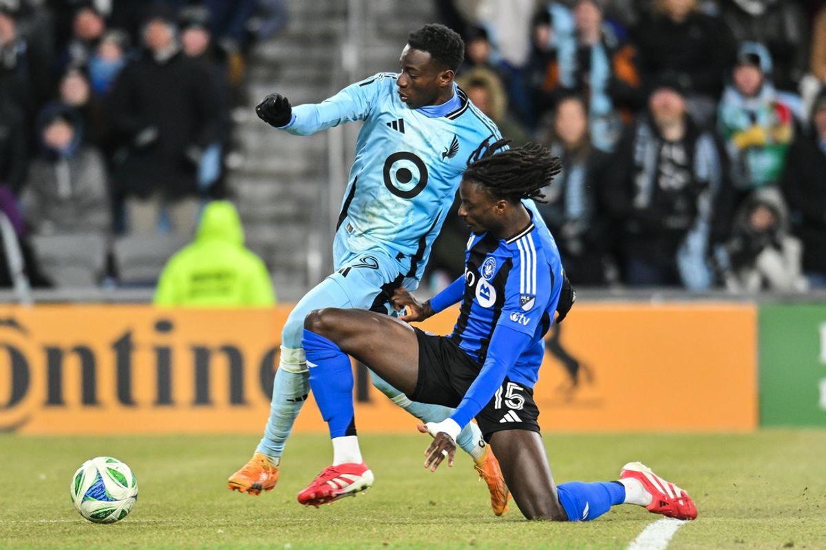 Mar 1, 2025; Saint Paul, Minnesota, USA; Minnesota United forward Kelvin Yeboah (9) and CF Montréal midfielder Ousman Jabang (15) battle for the ball during the second half at Allianz Field. Mandatory Credit: Jeffrey Becker-Imagn Images