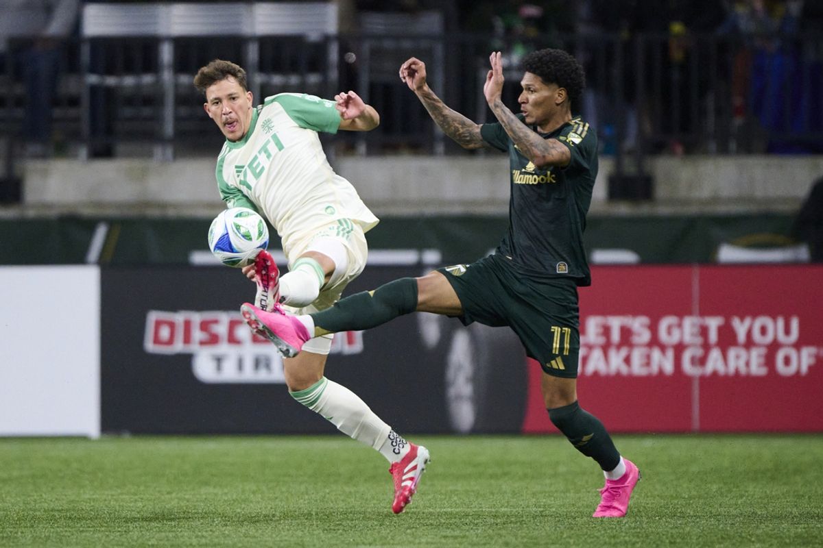 Mar 1, 2025; Portland, Oregon, USA; Austin FC defender Guilherme Biro (29) and Portland Timbers forward Antony (11) battle for control of the ball during the first half at Providence Park. Mandatory Credit: Troy Wayrynen-Imagn Images