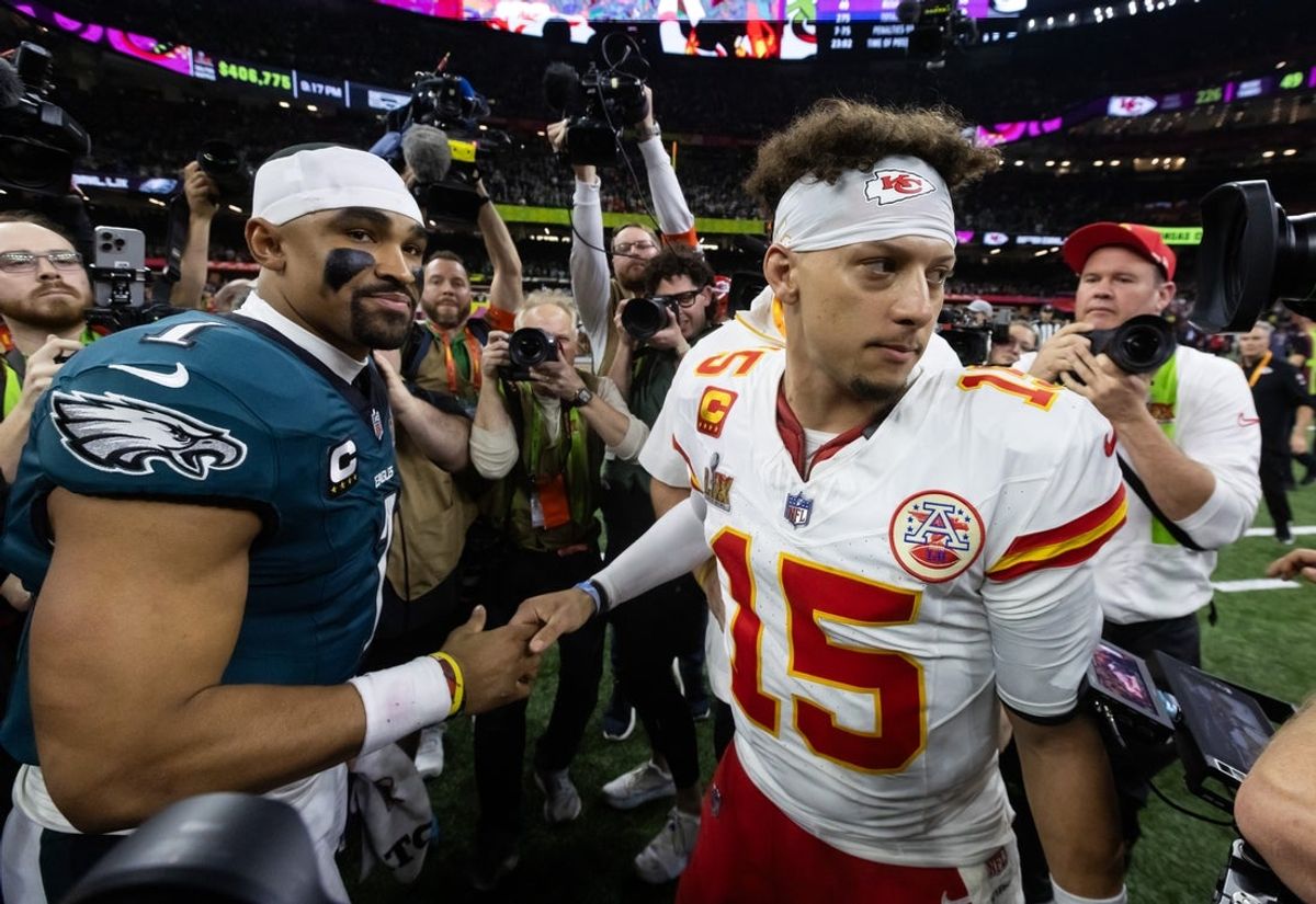 Feb 9, 2025; New Orleans, LA, USA; Philadelphia Eagles quarterback Jalen Hurts (1) greets Kansas City Chiefs quarterback Patrick Mahomes (15) following Super Bowl LIX at Ceasars Superdome. Mandatory Credit: Mark J. Rebilas-Imagn Images