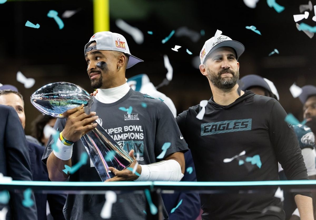 Feb 9, 2025; New Orleans, LA, USA; Philadelphia Eagles quarterback Jalen Hurts (left) and head coach Nick Sirianni celebrate with the Vince Lombardi Trophy after defeating the Kansas City Chiefs during Super Bowl LIX at Ceasars Superdome. Mandatory Credit: Mark J. Rebilas-Imagn Images