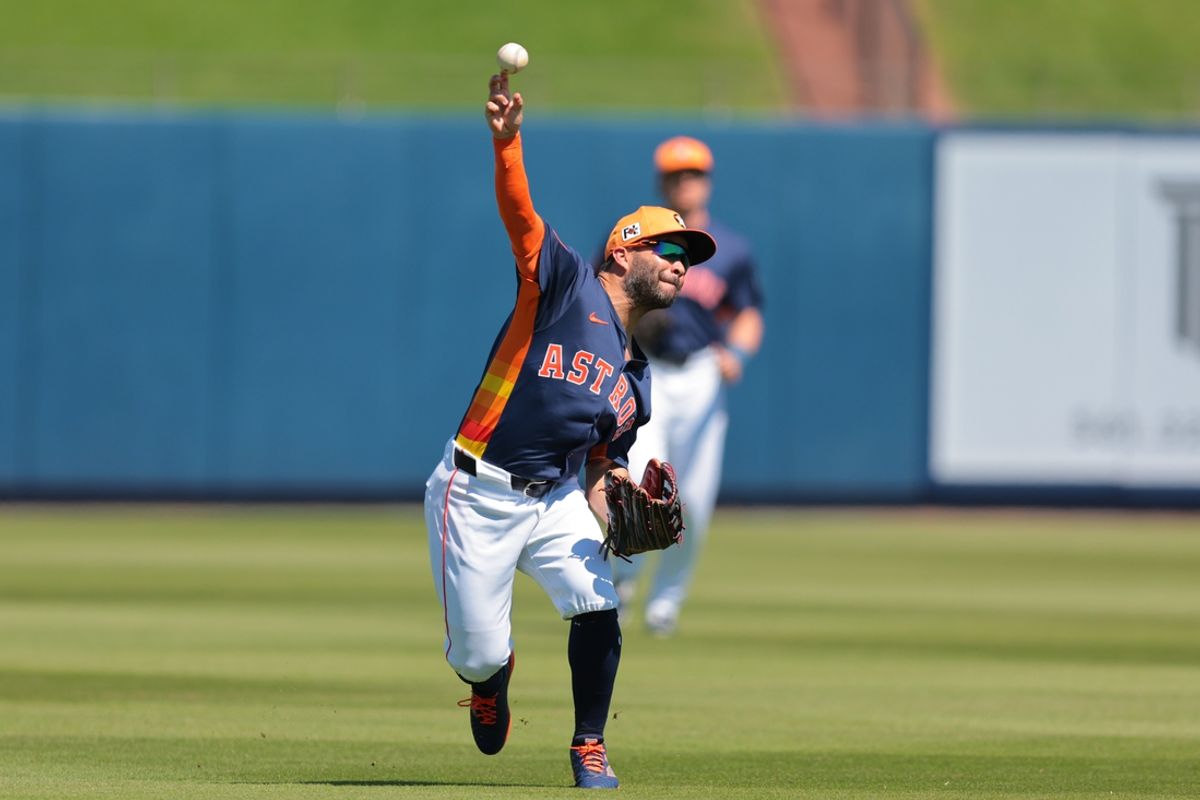 Mar 2, 2025; West Palm Beach, Florida, USA; Houston Astros left fielder Jose Altuve (27) throws to home plate but cannot retire Washington Nationals first baseman Nathaniel Lowe (not pictured) during the first inning at CACTI Park of the Palm Beaches. Mandatory Credit: Sam Navarro-Imagn Images