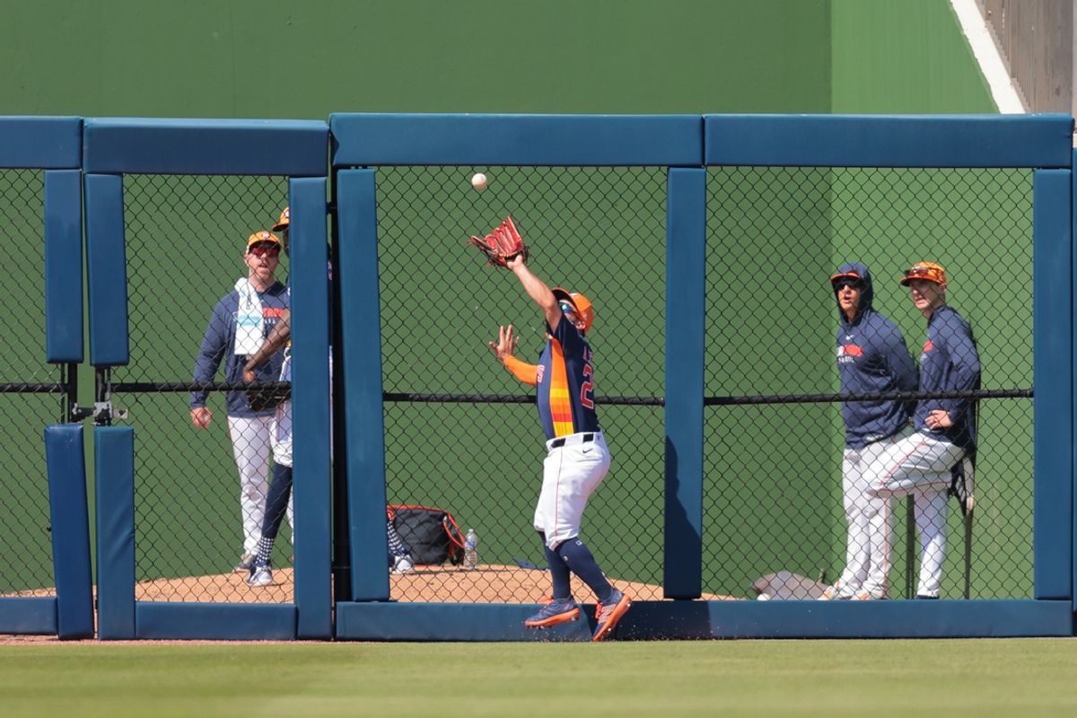 Mar 2, 2025; West Palm Beach, Florida, USA; Houston Astros second baseman Jose Altuve (27) catches a fly ball and retires Washington Nationals catcher Keibert Ruiz (not pictured) during the third inning at CACTI Park of the Palm Beaches. Mandatory Credit: Sam Navarro-Imagn Images