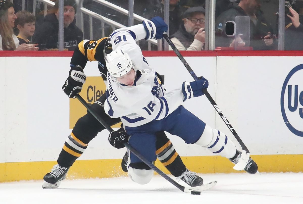 Mar 2, 2025; Pittsburgh, Pennsylvania, USA;  Pittsburgh Penguins defenseman Matt Grzelcyk (24) upends Toronto Maple Leafs right wing Mitch Marner (16) during the first period at PPG Paints Arena. Mandatory Credit: Charles LeClaire-Imagn Images
