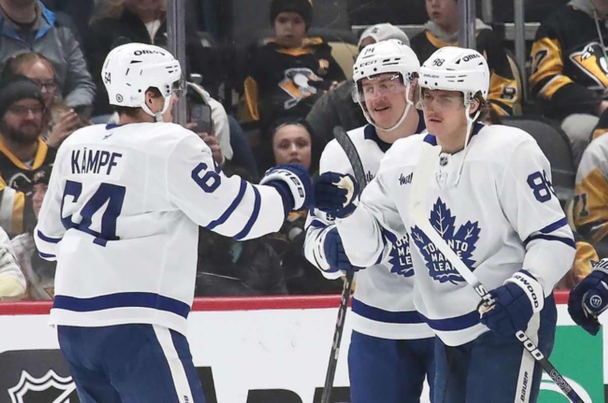 Mar 2, 2025; Pittsburgh, Pennsylvania, USA;  Toronto Maple Leafs center David Kampf (64) congratulates right wing William Nylander (88) on his game winning goal in overtime against the Pittsburgh Penguins at PPG Paints Arena. Mandatory Credit: Charles LeClaire-Imagn Images