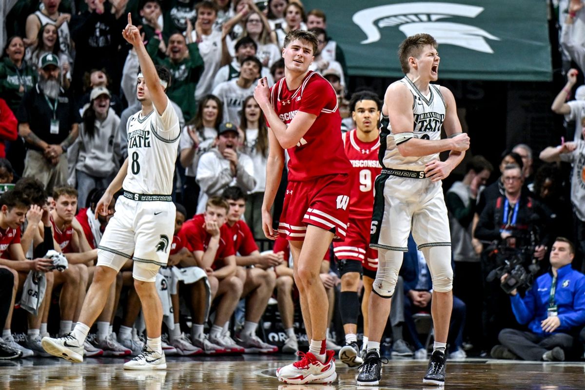 Michigan State's Jaxon Kohler, right, and Frankie Fidler, left, celebrate a turnover as Wisconsin's Nolan Winter, center, reacts during the second half on Sunday, March 2, 2025, at the Breslin Center in East Lansing.