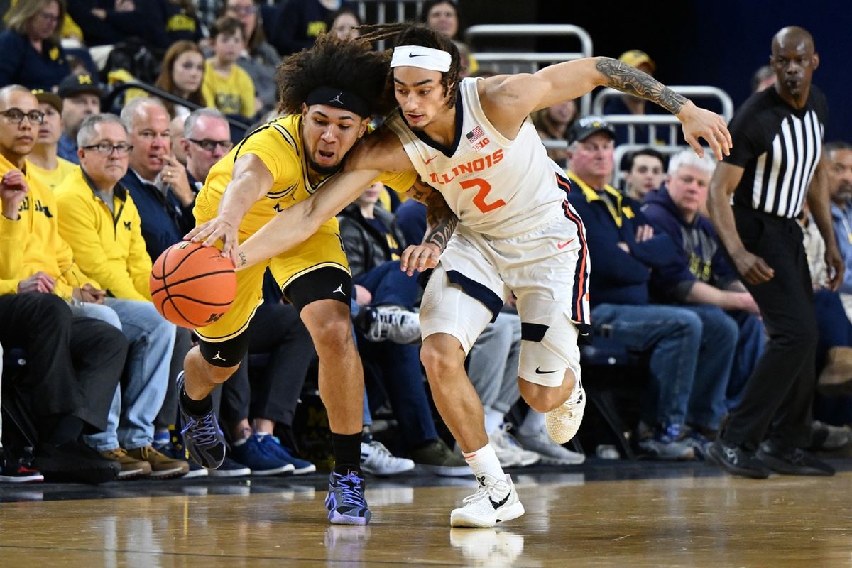 Mar 2, 2025; Ann Arbor, Michigan, USA; Michigan Wolverines guard Tre Donaldson (3) battles Illinois Fighting Illini guard Dra Gibbs-Lawhorn (2) for a loose ball in the first half at Crisler Center. Mandatory Credit: Lon Horwedel-Imagn Images