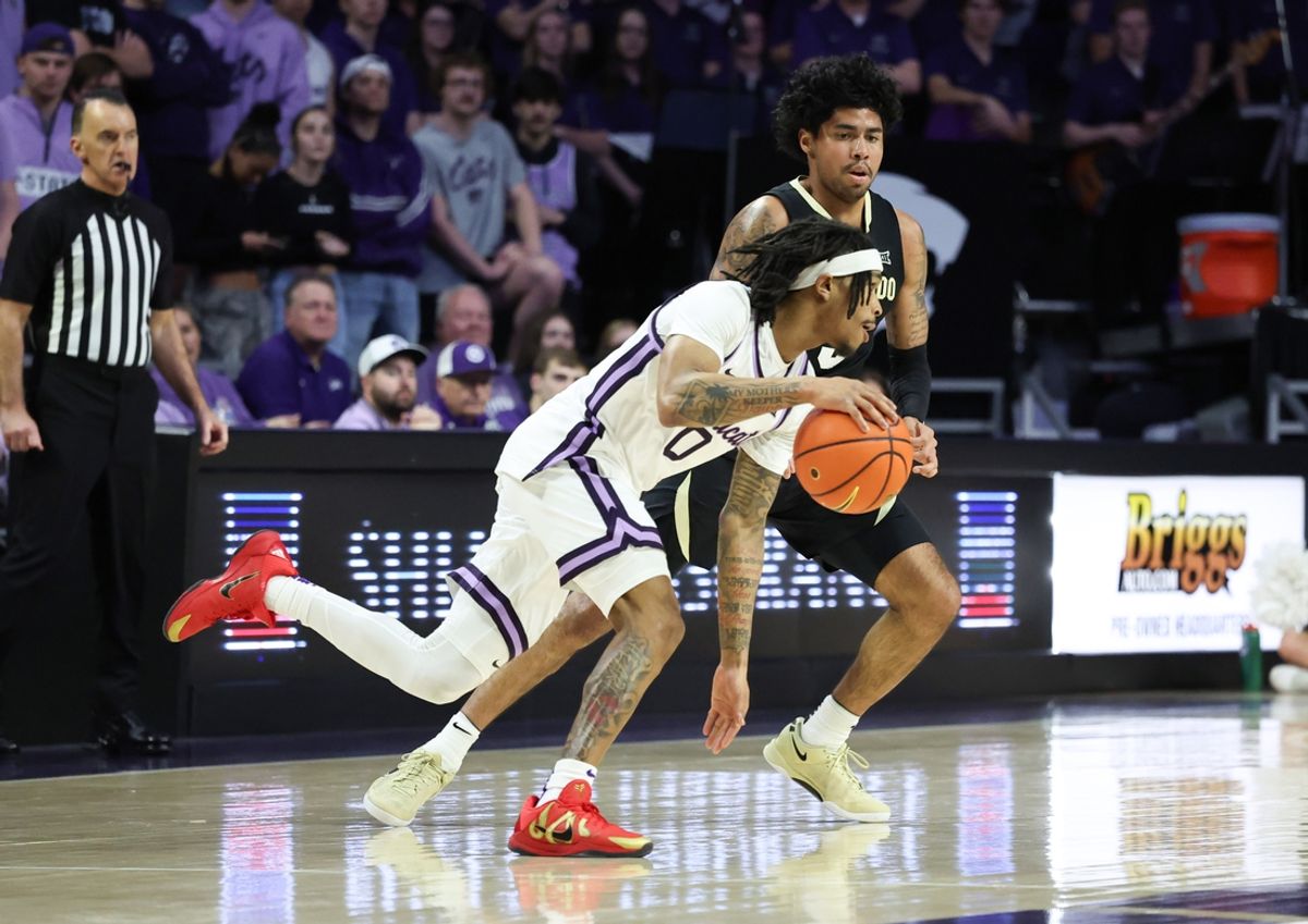 Mar 2, 2025; Manhattan, Kansas, USA; Kansas State Wildcats guard Dug McDaniel (0) is guarded by Colorado Buffaloes guard Julian Hammond III (3) during the first half at Bramlage Coliseum. Mandatory Credit: Scott Sewell-Imagn Images