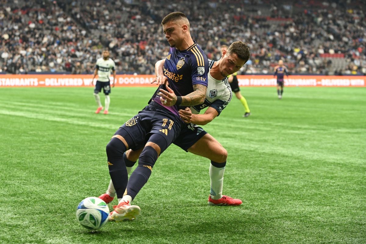 Mar 2, 2025; Vancouver, British Columbia, CAN;  LA Galaxy forward Gabriel Pec (11) traps the ball against Vancouver Whitecaps FC midfielder Sebastian Berhalter (16) during the first half at BC Place. Mandatory Credit: Anne-Marie Sorvin-Imagn Images