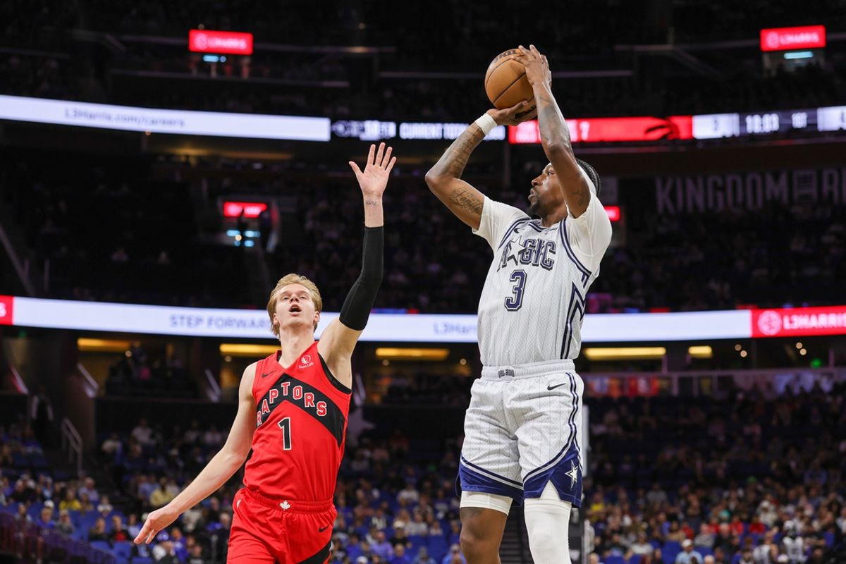 Mar 2, 2025; Orlando, Florida, USA; Orlando Magic guard Kentavious Caldwell-Pope (3) shoots against Toronto Raptors guard Gradey Dick (1) during the first quarter at Kia Center. Mandatory Credit: Mike Watters-Imagn Images