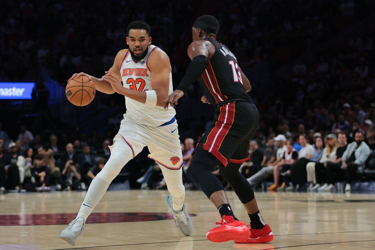 Mar 2, 2025; Miami, Florida, USA; New York Knicks center Karl-Anthony Towns (32) drives to the basket against Miami Heat center Bam Adebayo (13) during the second quarter at Kaseya Center. Mandatory Credit: Sam Navarro-Imagn Images