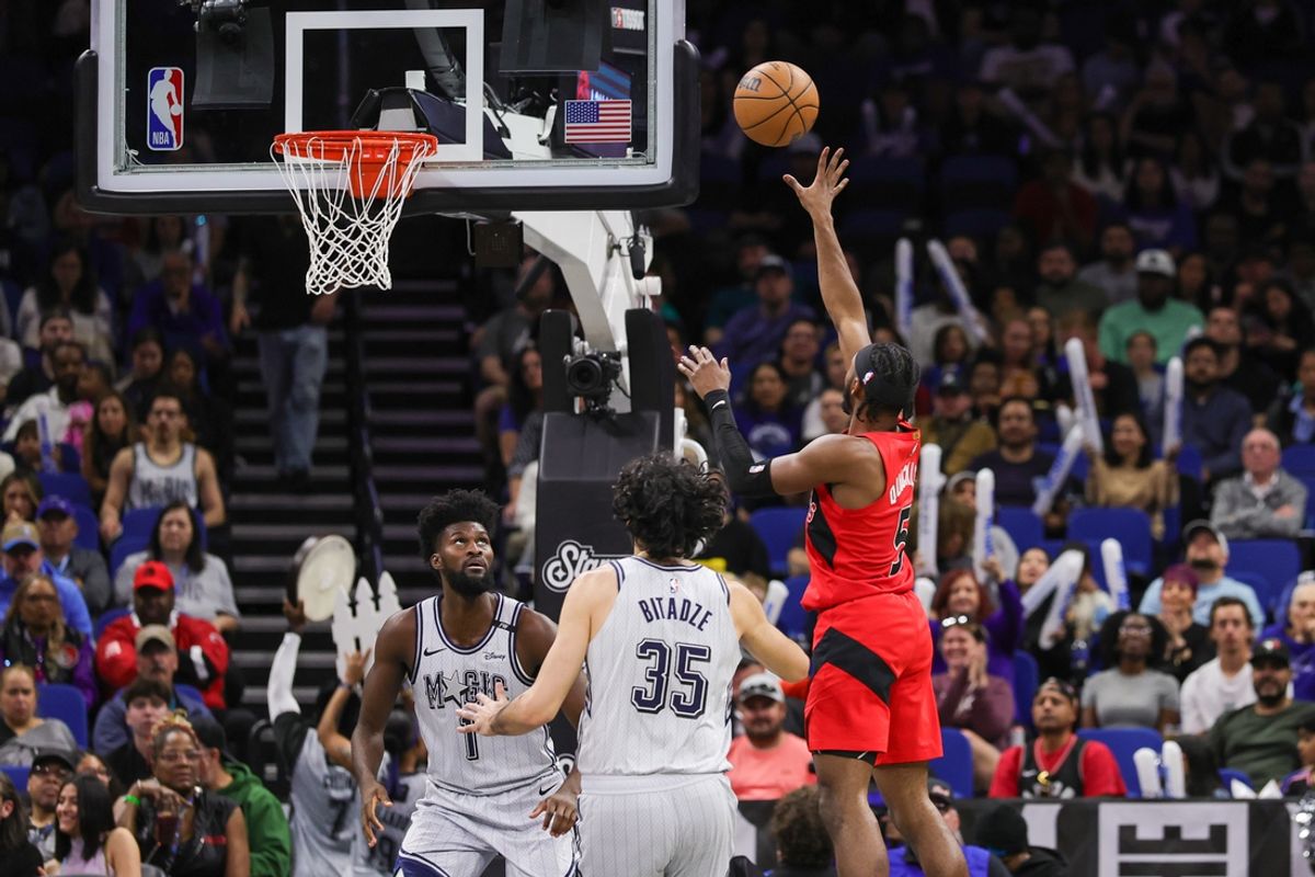 Mar 2, 2025; Orlando, Florida, USA; Toronto Raptors guard Immanuel Quickley (5) shoots against Orlando Magic forward Jonathan Isaac (1) during the second quarter at Kia Center. Mandatory Credit: Mike Watters-Imagn Images