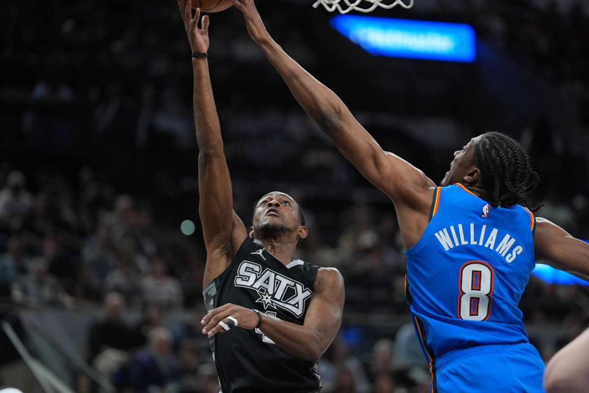 Mar 2, 2025; San Antonio, Texas, USA;  Oklahoma City Thunder forward Jalen Williams (8) blocks a shot by San Antonio Spurs guard De'Aaron Fox (4) in the first half at Frost Bank Center. Mandatory Credit: Daniel Dunn-Imagn Images