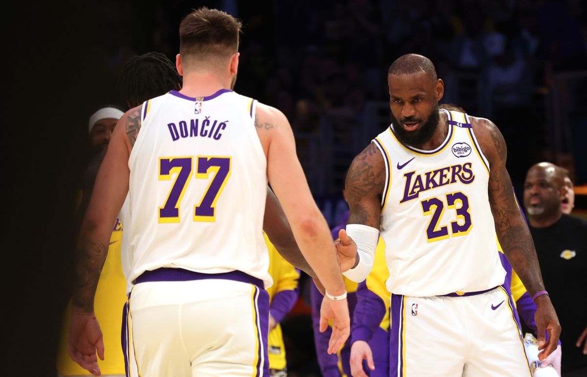Mar 2, 2025; Los Angeles, California, USA; Los Angeles Lakers forward LeBron James (23) and guard Luka Doncic (77) react after a play during the first quarter against the LA Clippers at Crypto.com Arena. Mandatory Credit: Jason Parkhurst-Imagn Images