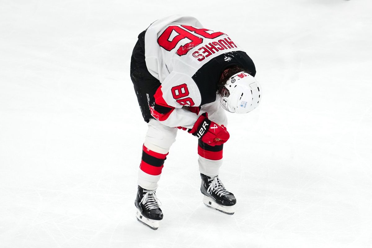 Mar 2, 2025; Las Vegas, Nevada, USA; New Jersey Devils center Jack Hughes (86) makes his way off the ice after sustaining an apparent injury during a play against the Vegas Golden Knights during the third period at T-Mobile Arena. Mandatory Credit: Stephen R. Sylvanie-Imagn Images