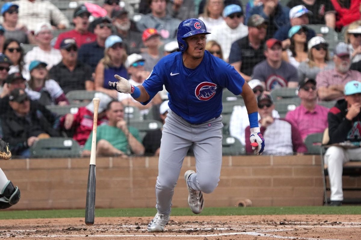 Mar 3, 2025; Salt River Pima-Maricopa, Arizona, USA; Chicago Cubs second baseman Nicky Lopez hits a double against the Arizona Diamondbacks in the second inning at Salt River Fields at Talking Stick. Mandatory Credit: Rick Scuteri-Imagn Images