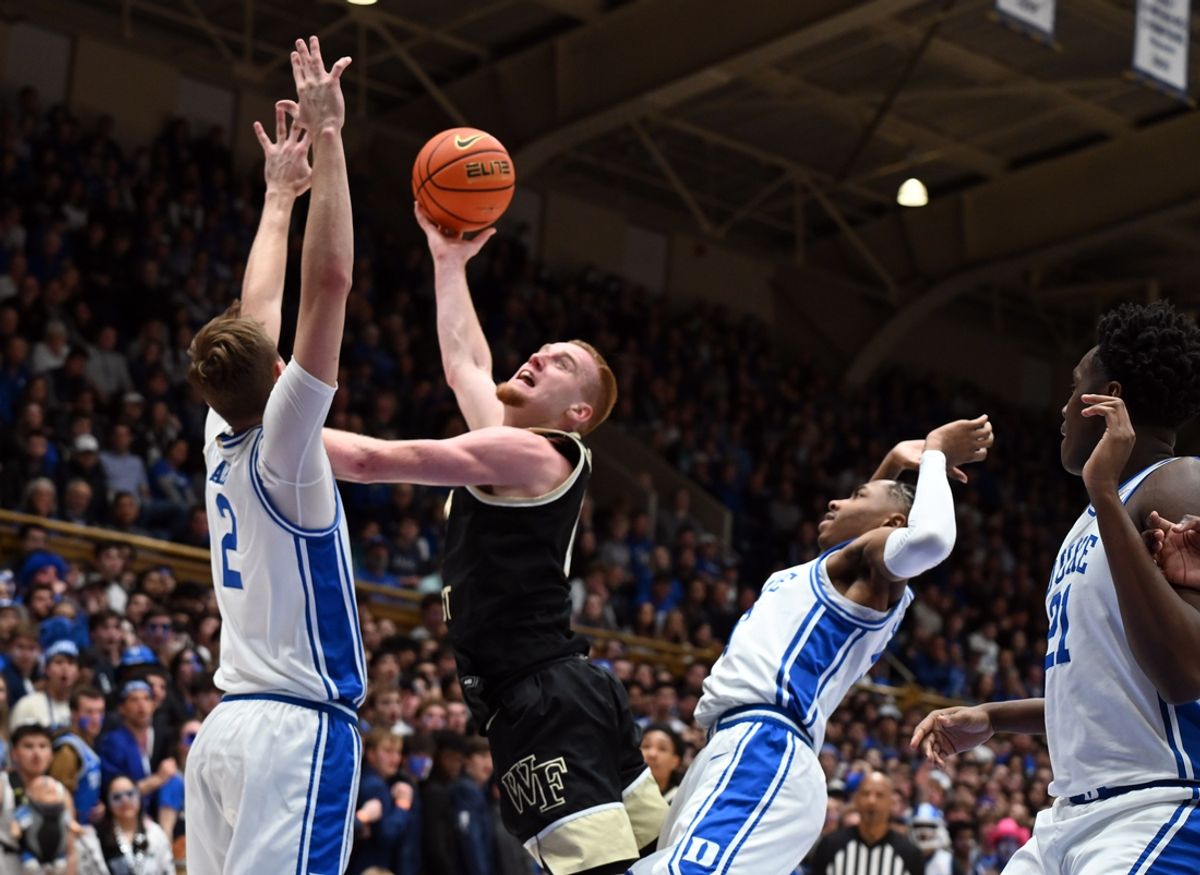 Mar 3, 2025; Durham, North Carolina, USA; Wake Forest Demon Deacons guard Cameron Hildreth (6) shoots the ball over Duke Blue Devils forward Cooper Flagg (2) during the first half at Cameron Indoor Stadium. Mandatory Credit: Rob Kinnan-Imagn Images
