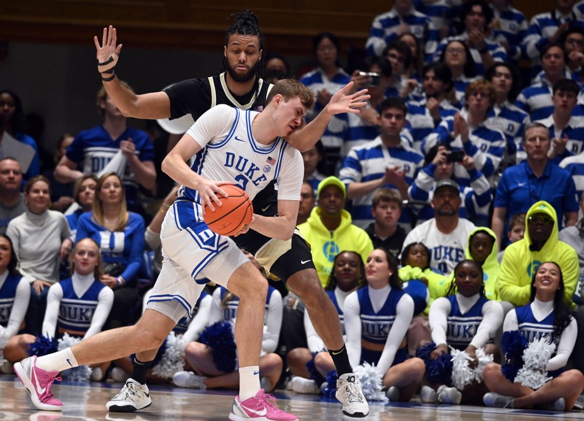Mar 3, 2025; Durham, North Carolina, USA; Duke Blue Devils forward Cooper Flagg (2) drives to the basket as Wake Forest Demon Deacons center Efton Reid III (4) defends during the first half at Cameron Indoor Stadium. Mandatory Credit: Rob Kinnan-Imagn Images
