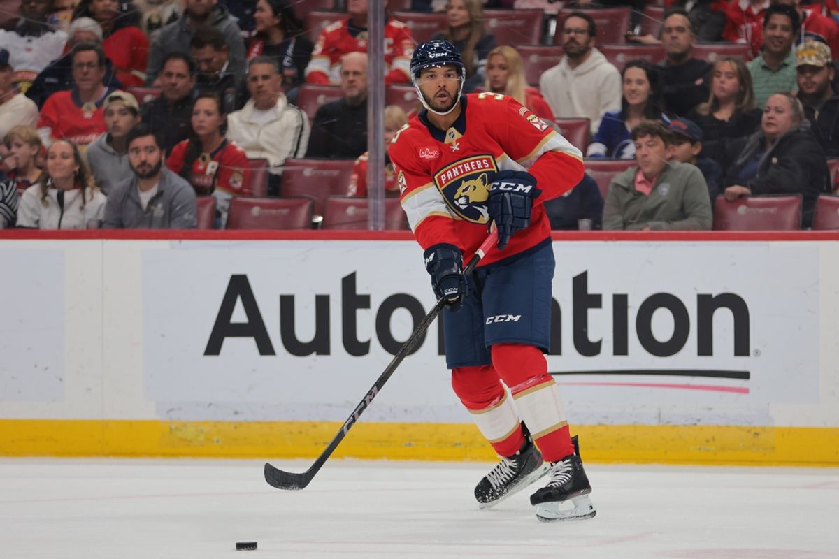 Mar 3, 2025; Sunrise, Florida, USA; Florida Panthers defenseman Seth Jones (3) moves the puck against the Tampa Bay Lightning during the first period at Amerant Bank Arena. Mandatory Credit: Sam Navarro-Imagn Images