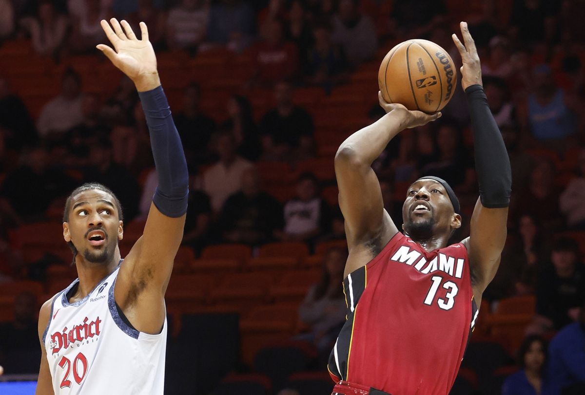 Mar 3, 2025; Miami, Florida, USA;  Miami Heat center Bam Adebayo (13) shoots around Washington Wizards forward Alex Sarr (20) during the first half at Kaseya Center. Mandatory Credit: Rhona Wise-Imagn Images