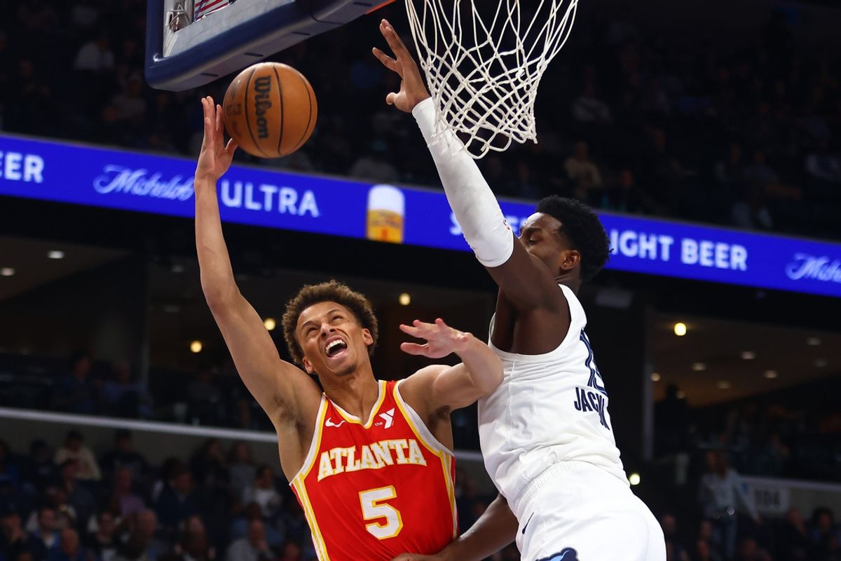 Mar 3, 2025; Memphis, Tennessee, USA; Atlanta Hawks guard Dyson Daniels (5) shoots as Memphis Grizzlies forward Jaren Jackson Jr. (13) defends during the first quarter at FedExForum. Mandatory Credit: Petre Thomas-Imagn Images
