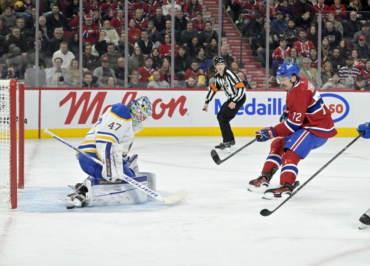 Mar 3, 2025; Montreal, Quebec, CAN; Buffalo Sabres goalie James Reimer (47) stops Montreal Canadiens defenseman Arber Xhekaj (72) during the second period at the Bell Centre. Mandatory Credit: Eric Bolte-Imagn Images
