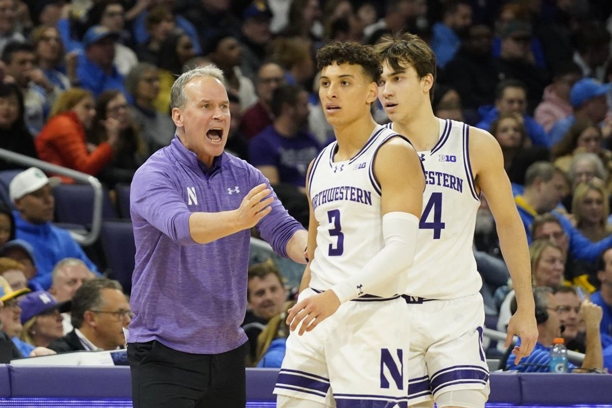Mar 3, 2025; Evanston, Illinois, USA; Northwestern Wildcats head coach Chris Collins talks with guard Ty Berry (3) during the first half against the UCLA Bruins at Welsh-Ryan Arena. Mandatory Credit: David Banks-Imagn Images