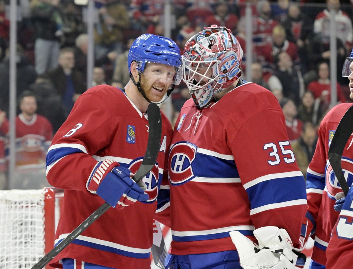 Mar 3, 2025; Montreal, Quebec, CAN; Montreal Canadiens defenseman Mike Matheson (8) celebrates with teammate goalie Sam Montembeault (35) after scoring the game winning goal against the Buffalo Sabres during the overtime period at the Bell Centre. Mandatory Credit: Eric Bolte-Imagn Images