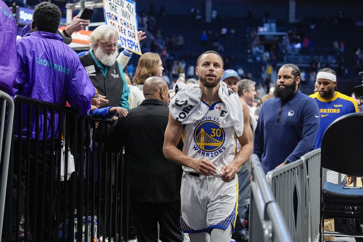 Mar 3, 2025; Charlotte, North Carolina, USA;  Golden State Warriors guard Stephen Curry (30) reacts to his home town fans as he makes his way to the locker rooom after the second half against the Charlotte Hornets at Spectrum Center. Mandatory Credit: Jim Dedmon-Imagn Images