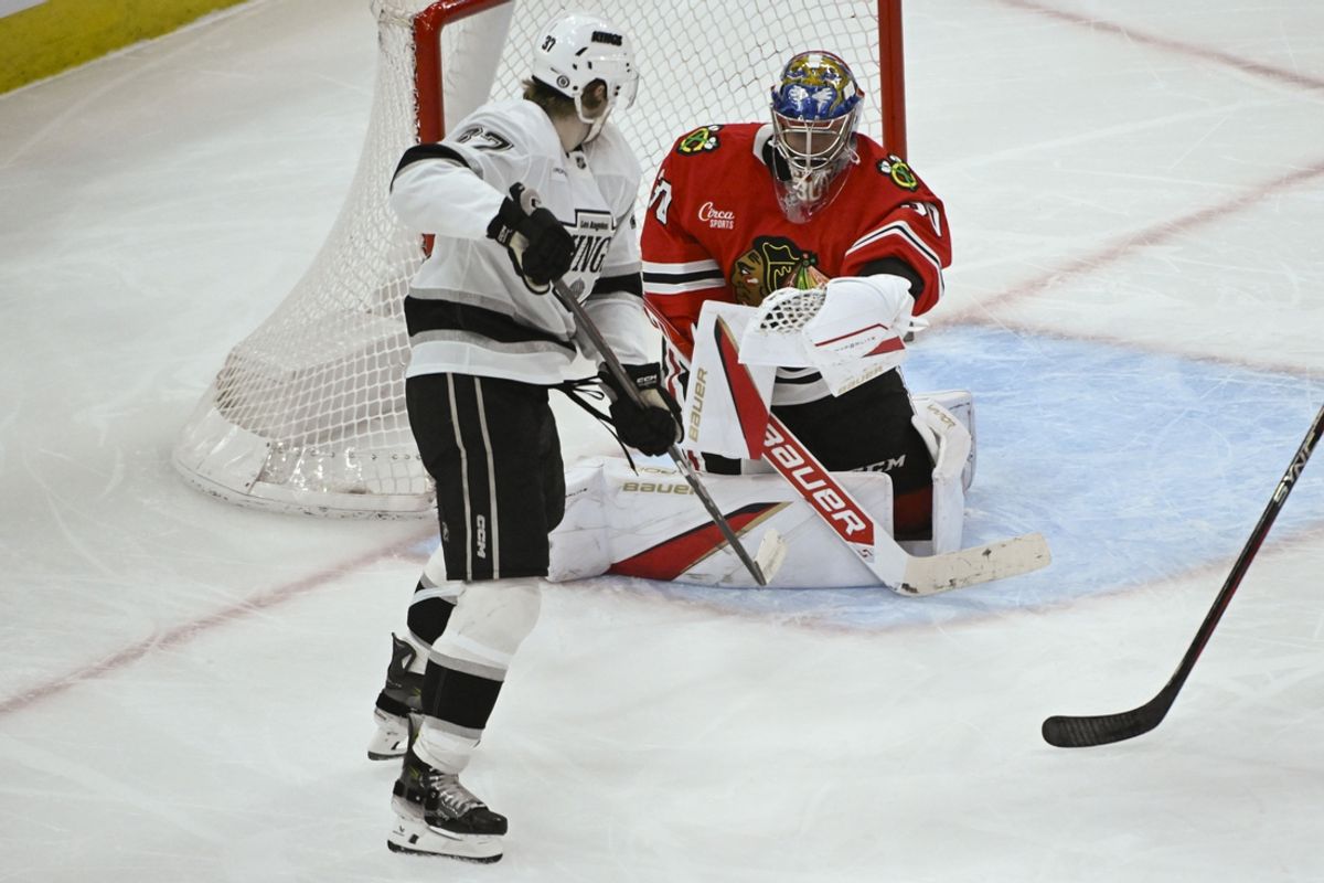 Mar 3, 2025; Chicago, Illinois, USA;  Chicago Blackhawks goaltender Spencer Knight defends against Los Angeles Kings left wing Warren Foegele (37) during the second period at the United Center. Mandatory Credit: Matt Marton-Imagn Images