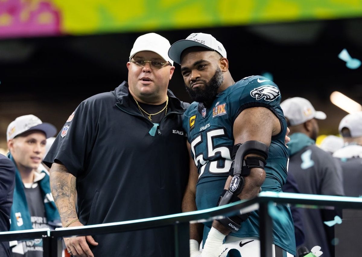 Feb 9, 2025; New Orleans, LA, USA; Philadelphia Eagles defensive end Brandon Graham (55) with team security guard Dom DiSandro after defeating the Kansas City Chiefs during Super Bowl LIX at Ceasars Superdome. Mandatory Credit: Mark J. Rebilas-Imagn Images