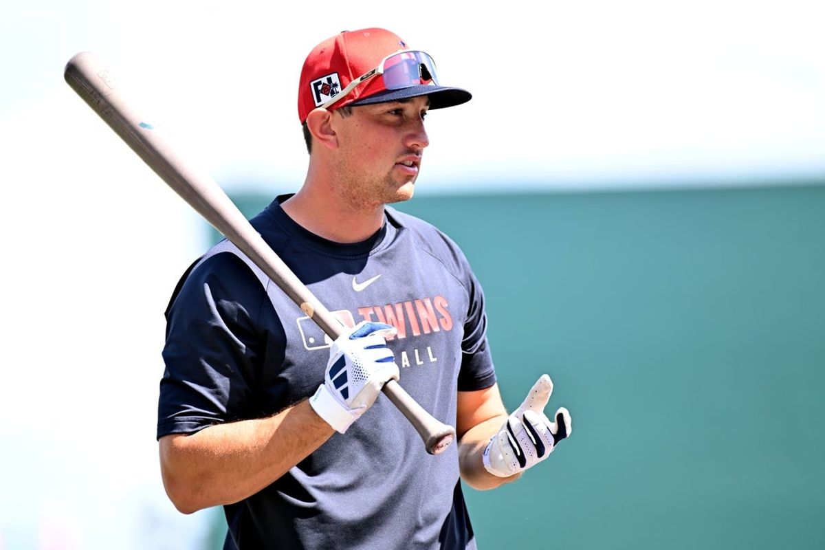 Mar 4, 2025; North Port, Florida, USA; Minnesota Twins shortstop Brooks Lee (2)  prepares to take batting practice  before the start of the spring training game against the Atlanta Braves  at CoolToday Park. Mandatory Credit: Jonathan Dyer-Imagn Images