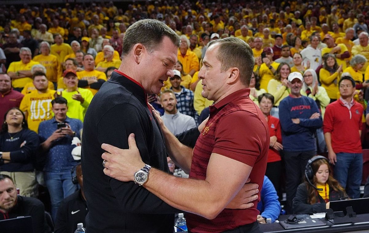 Iowa State Cyclones men's basketball head coach T.J. Otzelberger greets Arizona Wildcats men's basketball head coach Tommy Lloyd before cyclones and Wildcats game in the Big-12 men’s basketball showdown at Hilton Coliseum on Saturday March 1, 2025 in Ames, Iowa.