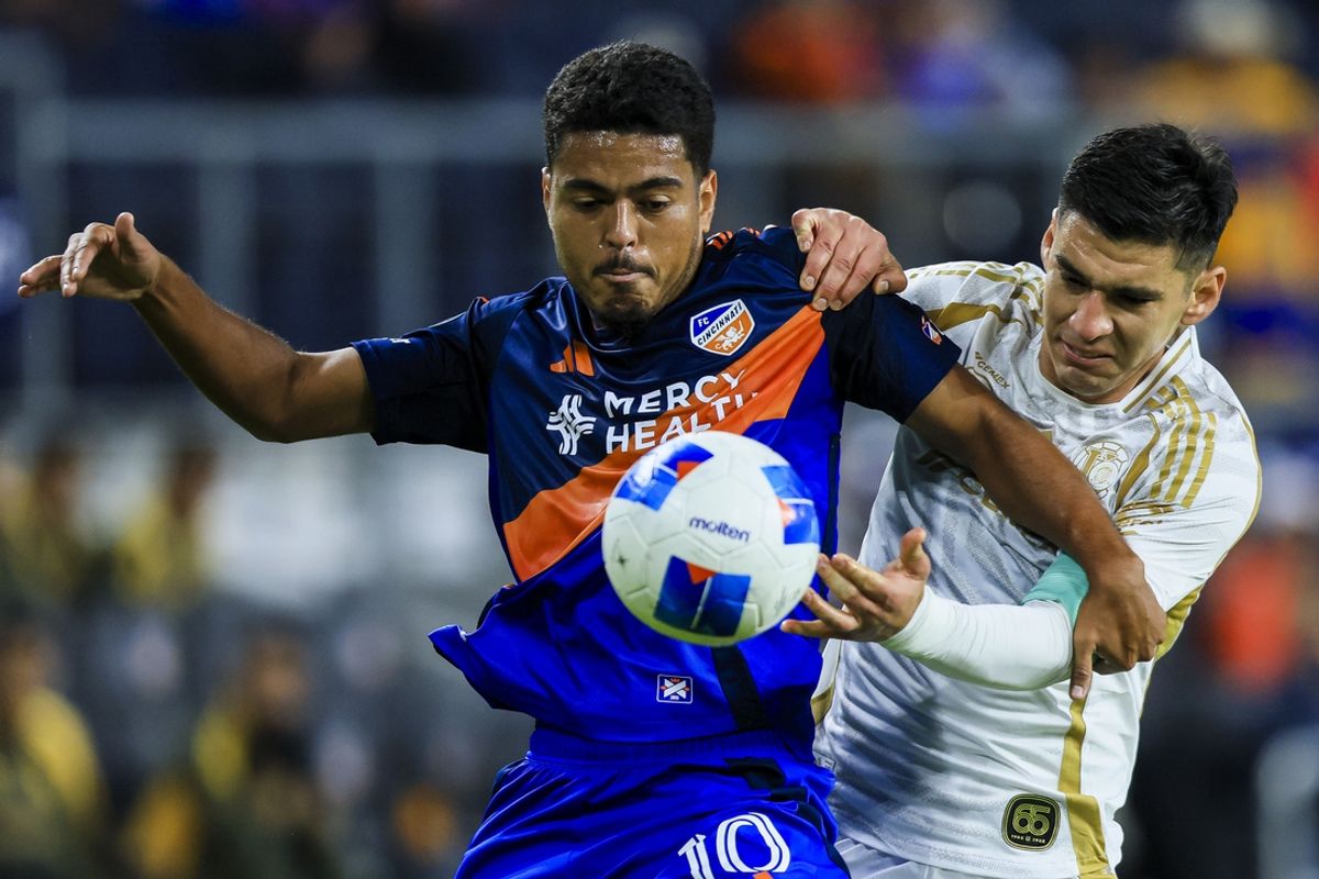 Mar 4, 2025; Cincinnati, Ohio, USA; FC Cincinnati midfielder Evander (10) battles for the ball against Tigres UANL defender Jesus Angulo (27) in the first half at TQL Stadium. Mandatory Credit: Katie Stratman-Imagn Images