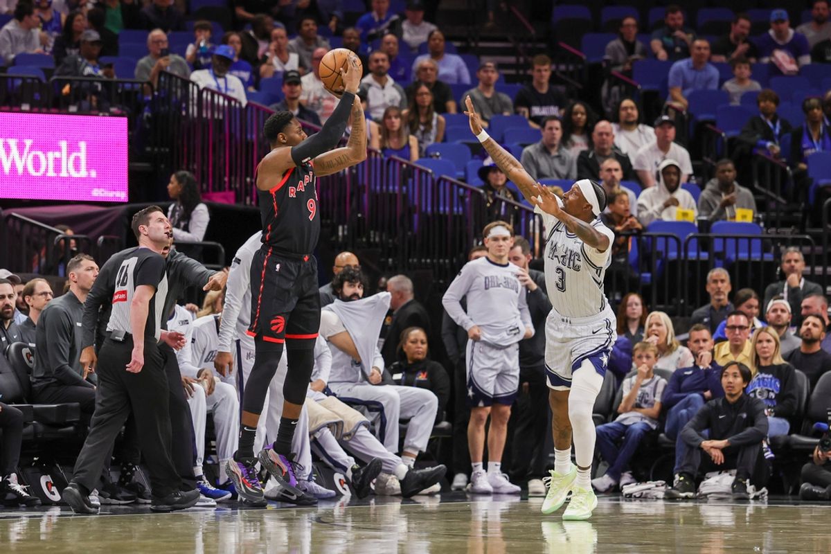 Mar 4, 2025; Orlando, Florida, USA; Toronto Raptors guard RJ Barrett (9) shoots a three point basket against Orlando Magic guard Kentavious Caldwell-Pope (3) during the first quarter at Kia Center. Mandatory Credit: Mike Watters-Imagn Images