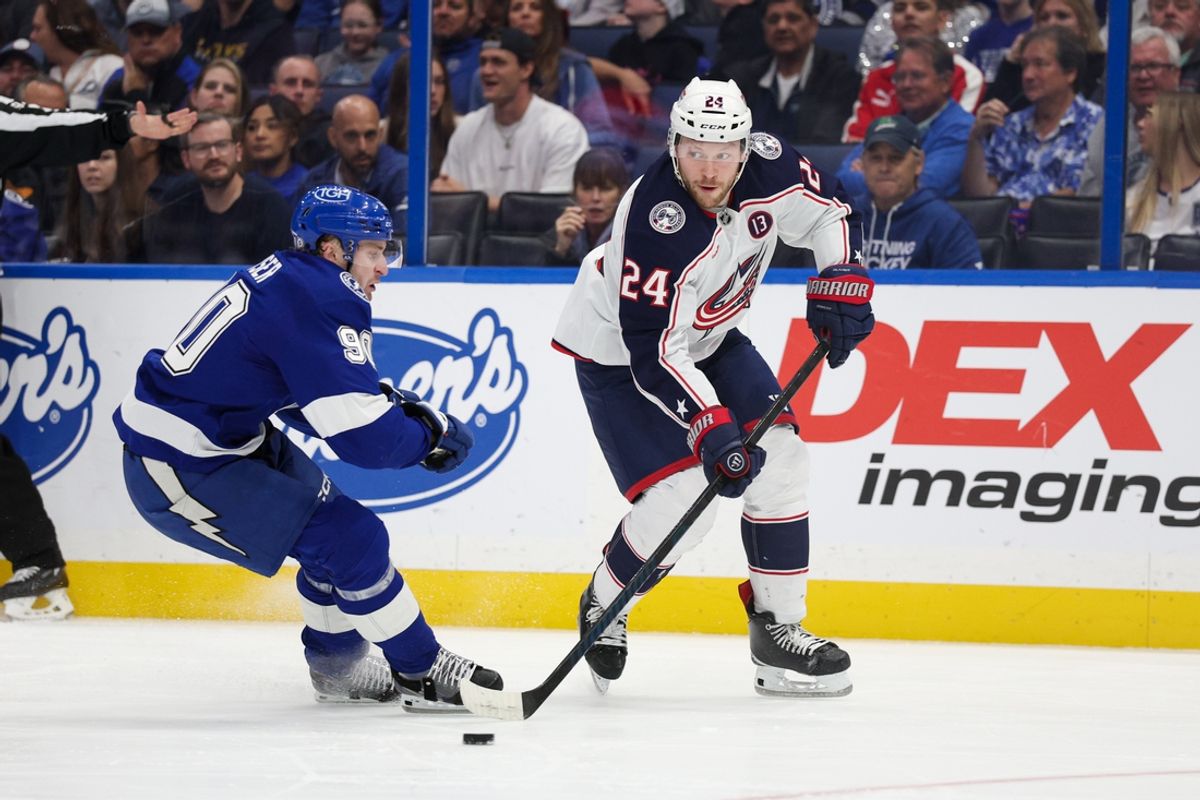 Mar 4, 2025; Tampa, Florida, USA; Columbus Blue Jackets right wing Mathieu Olivier (24) controls the puck against the Tampa Bay Lightning in the first period at Amalie Arena. Mandatory Credit: Nathan Ray Seebeck-Imagn Images
